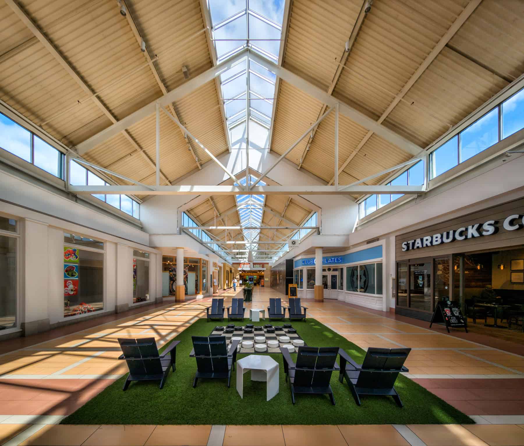 A faux lawn provides a spot to relax and maybe play checkers