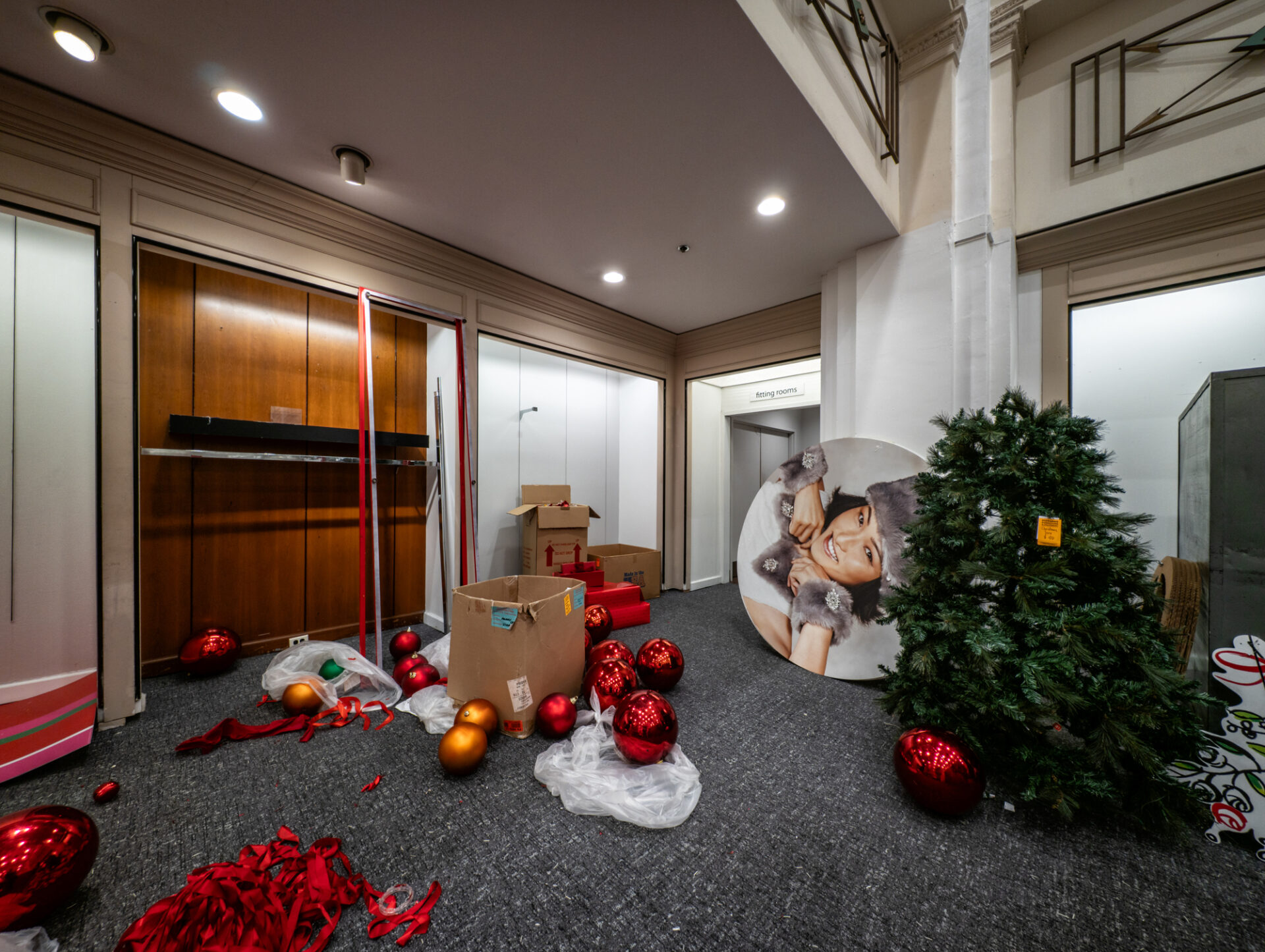 Scattered Christmas decorations during the store's final days
