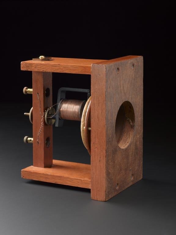Early type of Bell transmitter with membrane diaphragm. This is an exact replica of Bell's first telephone made in June 1875 and was made by Charles Williams Jr. of Boston, whose name is stamped on the baseboard.